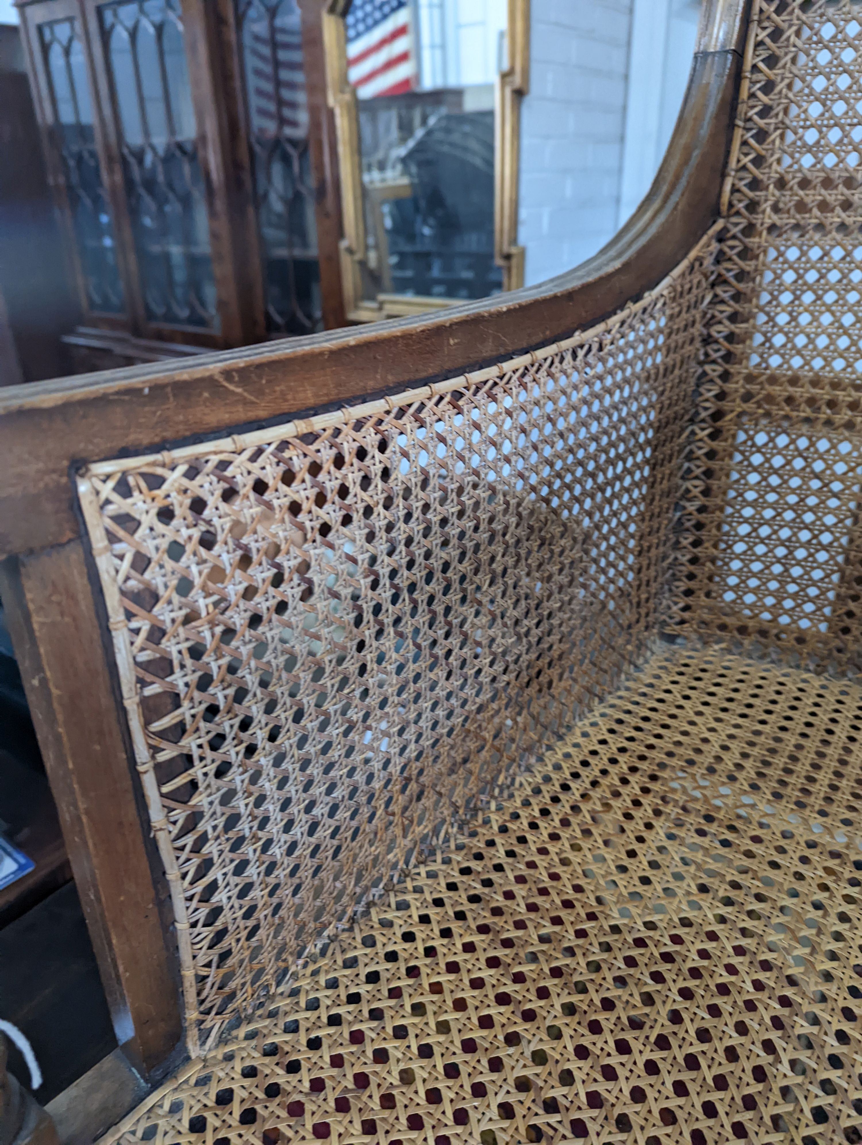 A Regency style mahogany bergere armchair, width 59cm, depth 56cm, height 97cm
